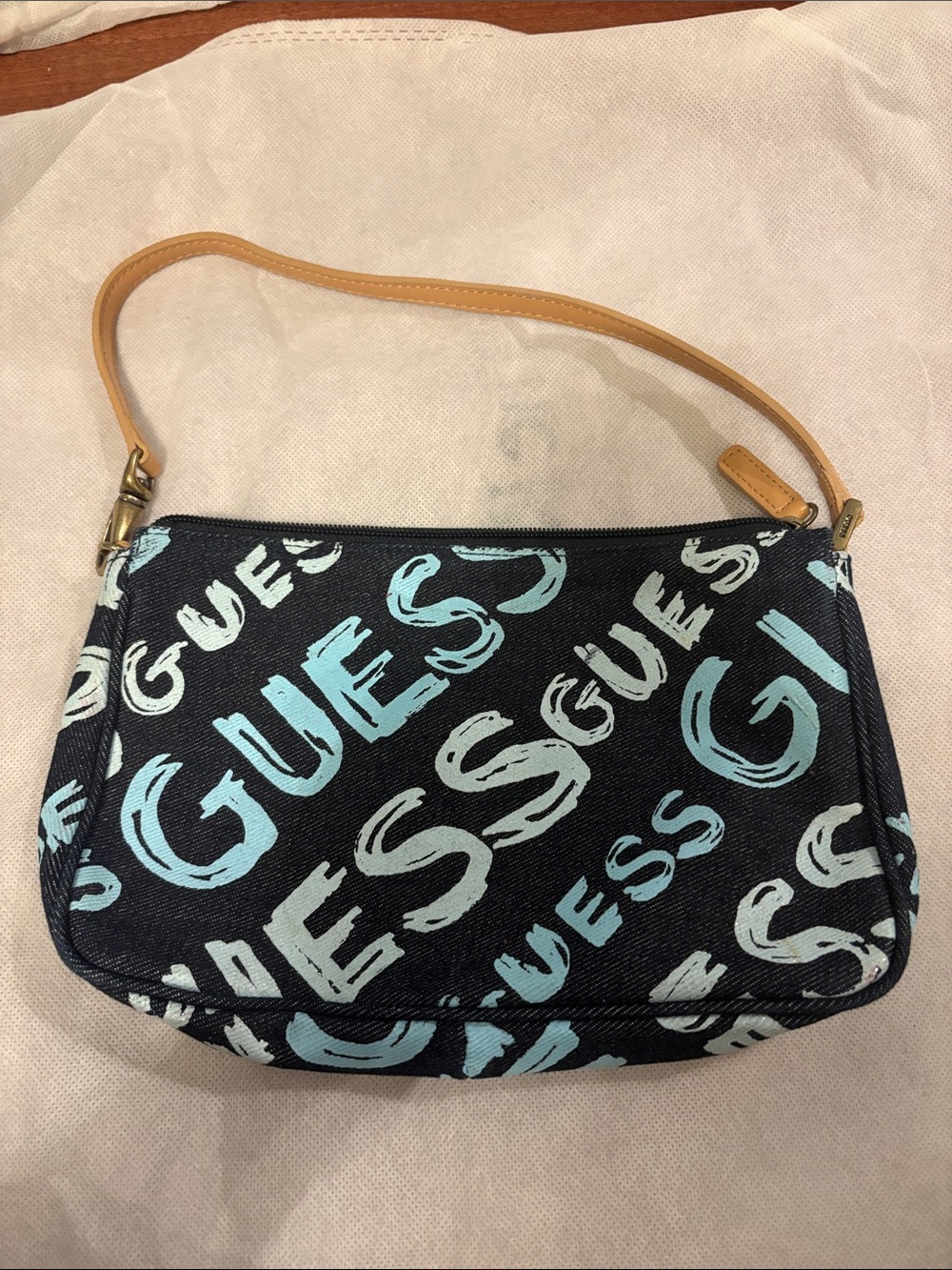 GUESS Black Shoulder Bag with Light Blue Logo Print and Tan Strap